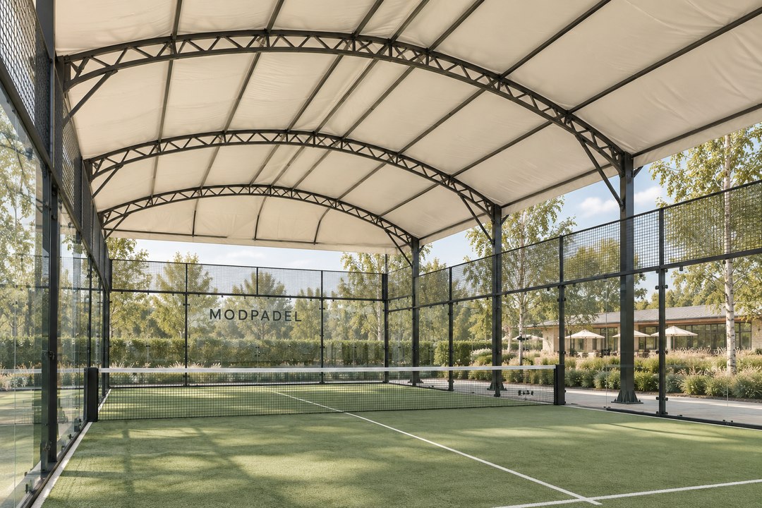 Steel trusses beneath the waterproof fabric of a ModPadel canopy